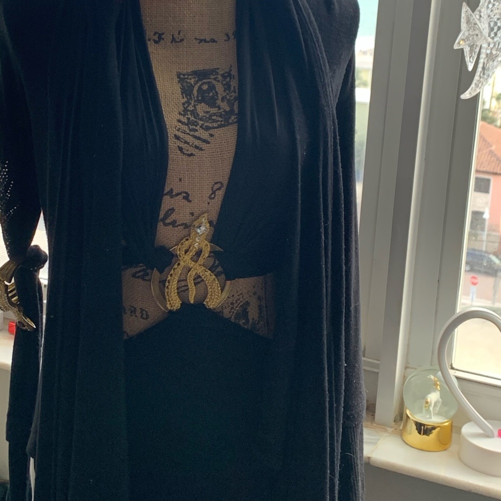 2 it’s a sweater with crystals in back in sleeves